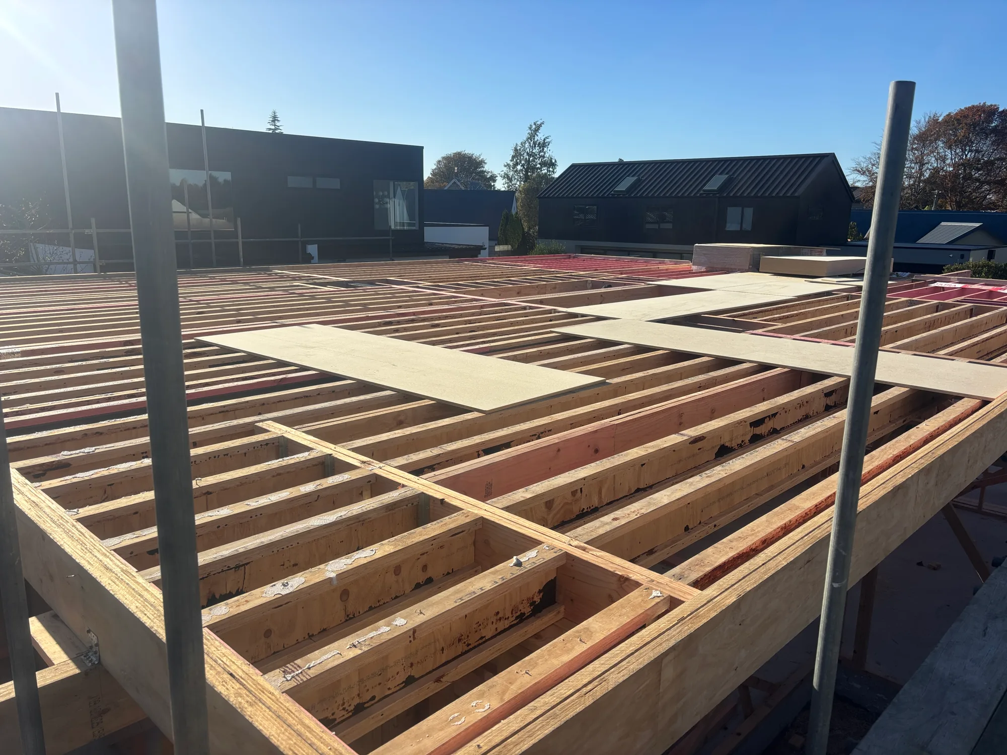 Upper floor joists and flooring underway on a Christchurch build
